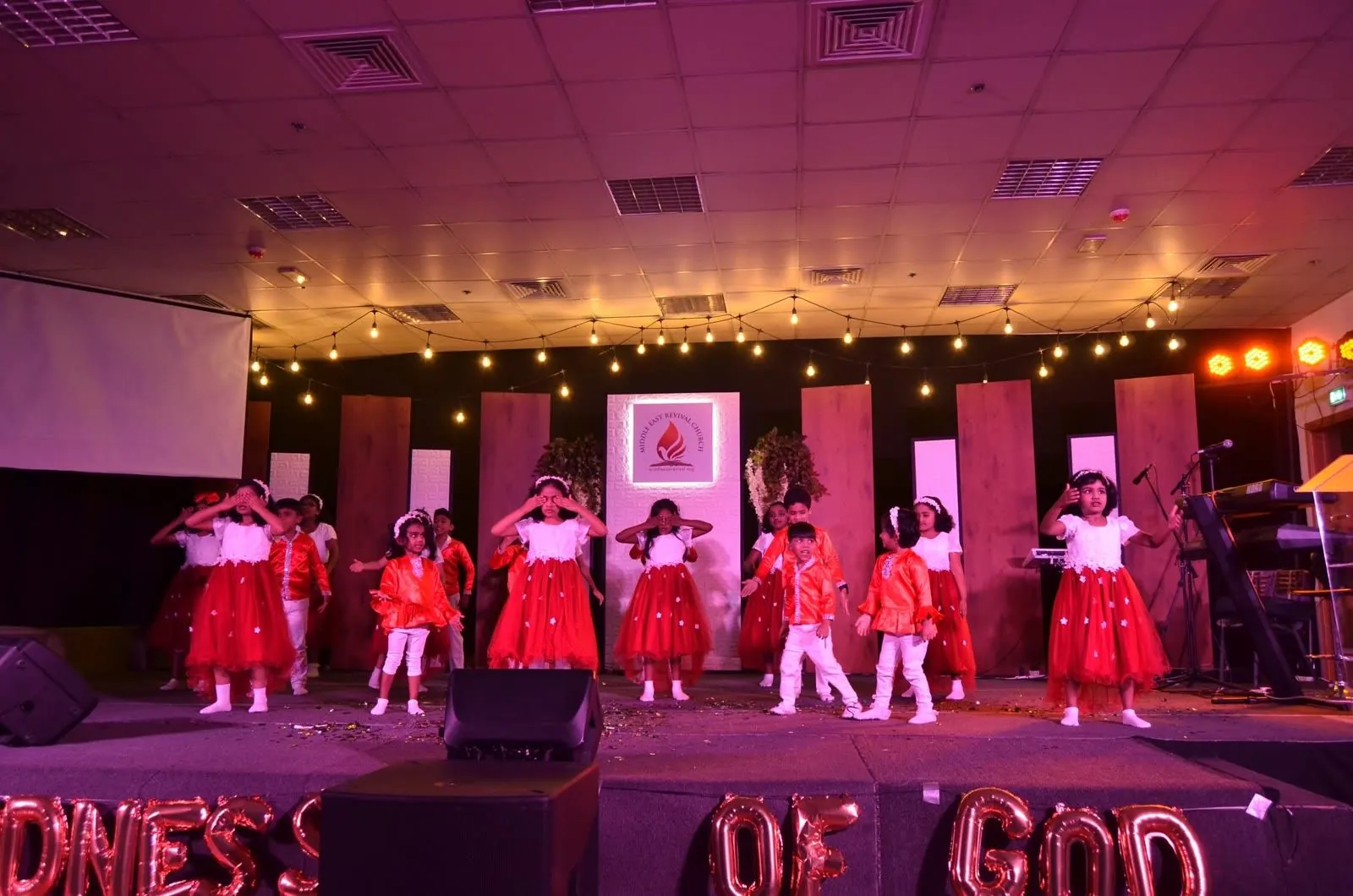 Little ones performing a dance at Kids Church